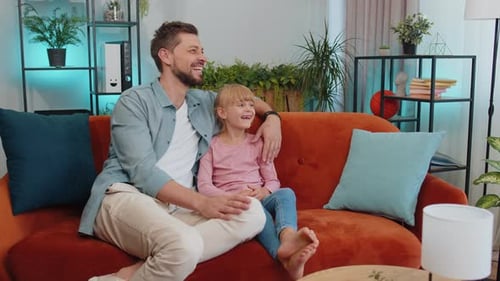 Father and Child Relaxing Together on Couch