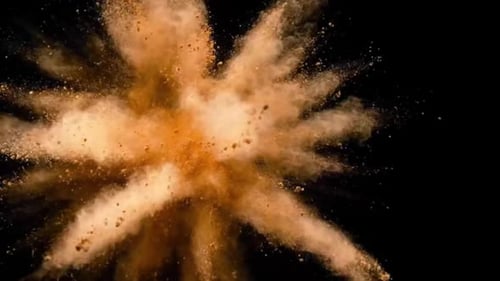 Splashing of yellow color. Closeup view.