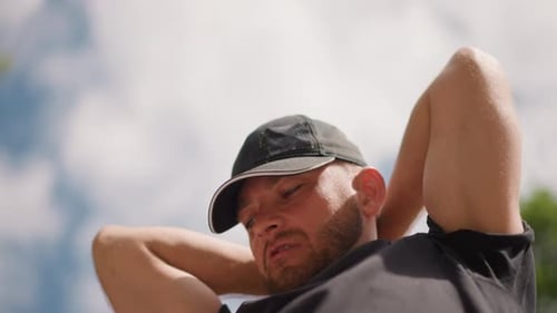 Man Stretching with Resistance Band Outdoors, Close Up
