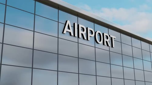 Airplane Passing Over a Airport Building