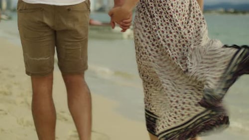 Couple Walking Together on the Beach in Australia. Red