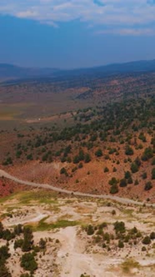 Amazing scenery of rocky landscape covered with little green bushes on tops.