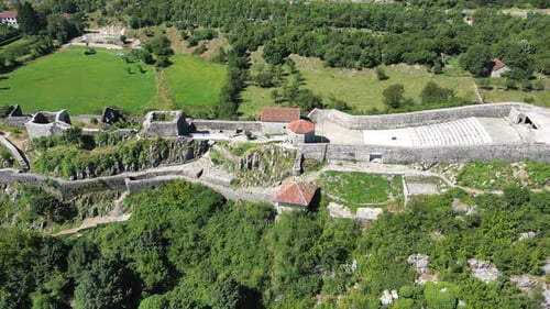 Side Flight of a Drone Along the Walls of an Old Fortress in Europe
