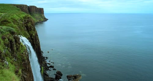 4k video footage of a waterfall meeting the ocean