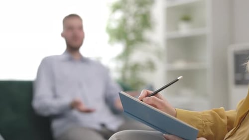 Man Talking with Therapist in Counseling Session