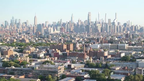 Establishing shot of the Manhattan skyline on a summer morning.