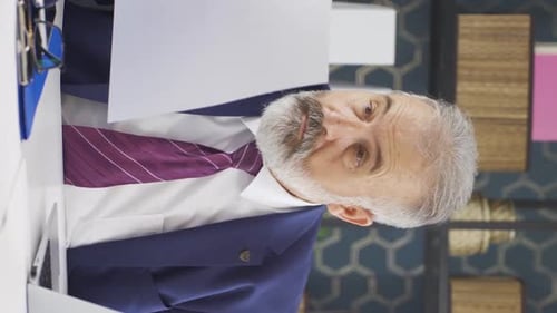 Businessman Working At Office Desk