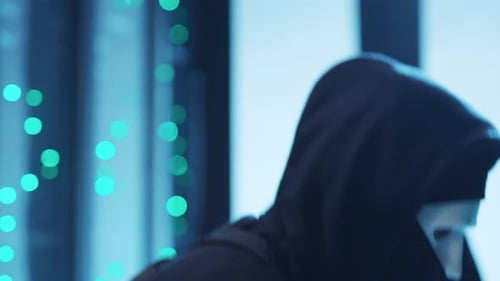 Hooded Hackers Breaking into Servers in Dark Room