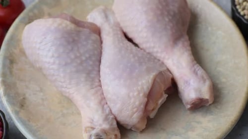 Raw Chicken Drumsticks on Plate Food Preparation Close