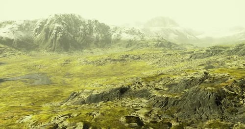 Vast Mountainous Landscape with Rocky Terrain and Distant Peaks Under Pale Sky
