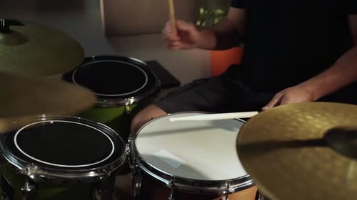 A Closeup View of a Drummer's Hands As They Play a Snare Drum During a Practice Session The Drummer