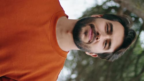 Handsome Bearded Man Vertical Portrait Smiling in Park Guy Holding Backpack