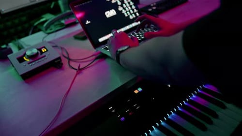 professional sound recording studio sound engineer or music producer sitting at the remote control