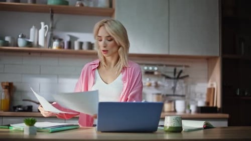 Blonde Woman Examining Documentation Working at Kitchen Closeup Lady Paperwork
