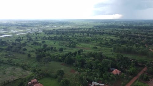Expansive Green Landscape: Rural Houses and Fields
