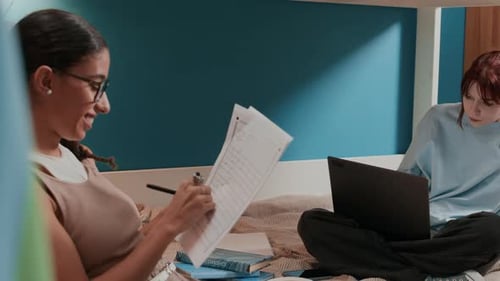 Students Studying Together in Bedroom