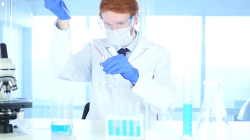 Scientist Busy Doing Chemical Reactions in Laboratory