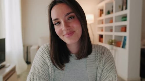 Woman Smiling and Looking at the Camera Indoors