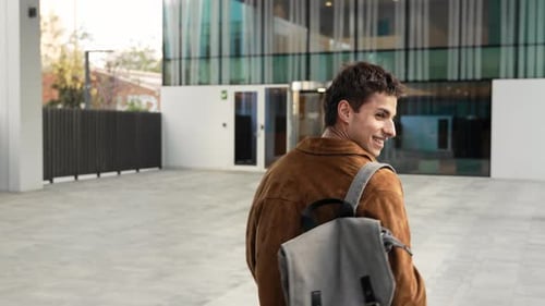 Carefree Young Man Walking Going to the Office Workplace Building