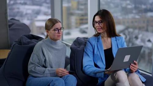 Women Collaborating in Modern Office Space