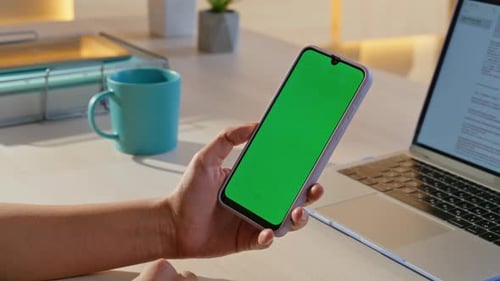 Hand Holding Green Screen Smartphone at Office Workplace Closeup Woman Phone