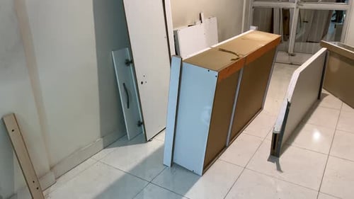 In an old Tehran house undergoing restoration carpenter works on wood furniture. Using tools like dr