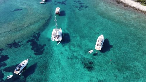 Boats Moored in Calm Turquoise Ocean Water