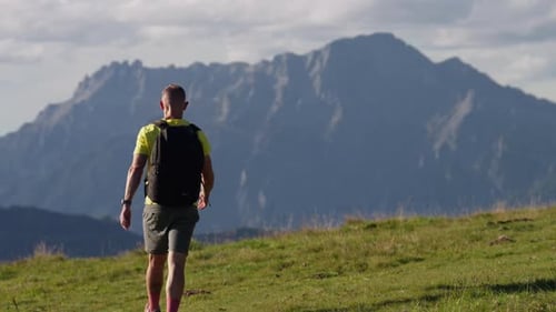 Man Walking In The Mountain Wilderness