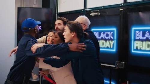 Agitated Crowd Pushing Past Security Guard at Sale