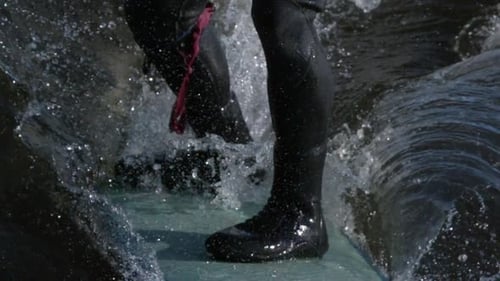 Surfer's Feet on Surfboard Riding Waves