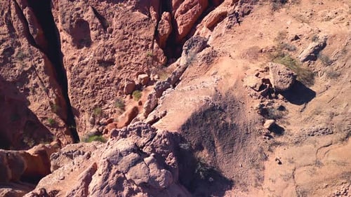 Aerial top view drone flying over scenic red rocky mountains