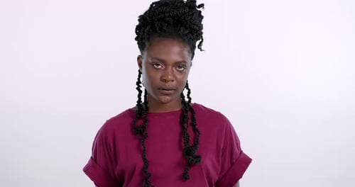 Frustrated, woman and face with rolling eyes for conflict or annoyed with problem in studio