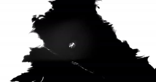L'encre noire se répand sur une surface blanche