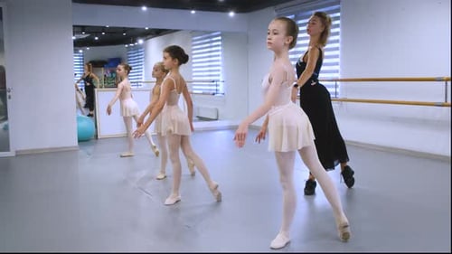Ballet Class with Children Practicing in Studio