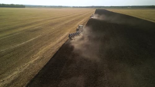 Tractors plowing the field in Ukraine