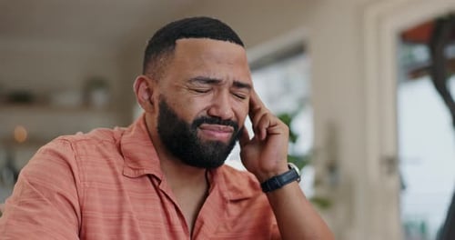 Bearded Man Experiencing Discomfort