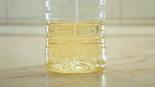 shot of Collection and recycling of used household edible oil. Recycling edible oil from a frying pa