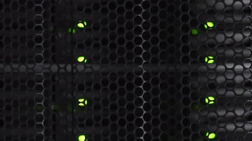 Dim white light slowly illuminates black protective mesh covering mainframe power indicator led ligh