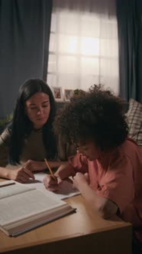 Army Soldier Mom Helping Young Son with School Homework