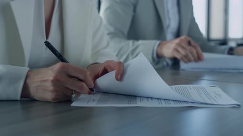 Business People Sign Contract in Office. Closeup Hand Holding Pen Put Signature