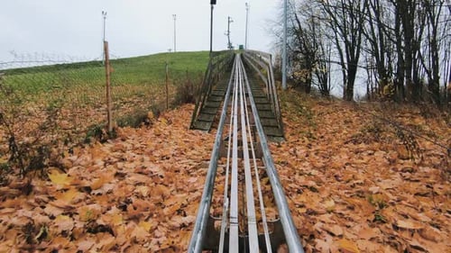 Autumn Roller Coaster Tracks Lead to Hilltop