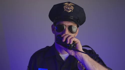 Police Officer Communicating with a Walkie Talkie