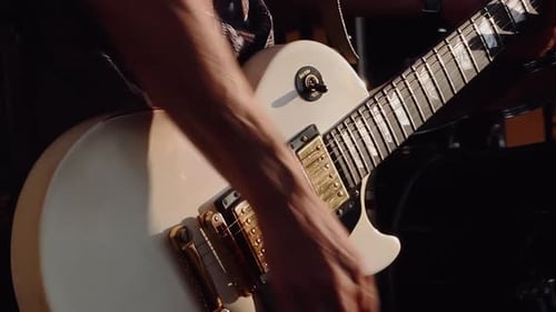Musician Plays An Electric Guitar.