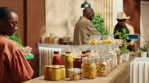 Customers Shopping at Urban Grocery Store