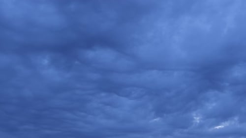 Swirling Dark Blue Clouds in a Dramatic Time-Lapse