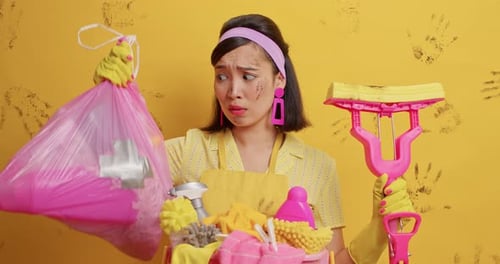 Woman with Cleaning Supplies, Yellow Background with Handprints