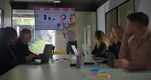 Professionals collaborate during a corporate meeting.