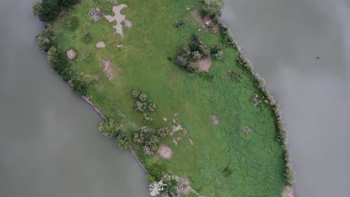 Rotating overhead aerial view of Penny Island in Sloan Lake near Denver.