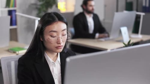 Concentrated Businesslady Using Computer in Office
