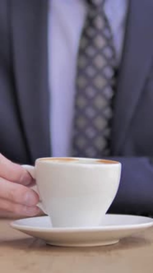 Close Up of Businessman Drinking Coffee, Vertical Video